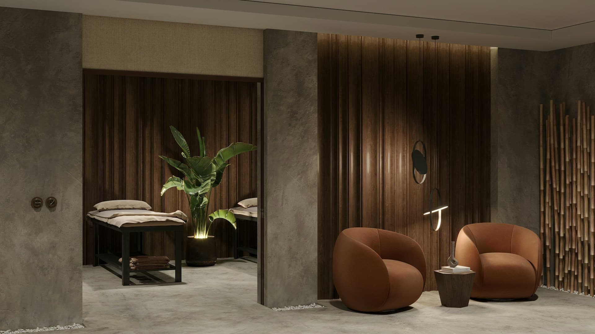 Modern aesthetic clinic treatment room with treatment beds and a lounge seating area